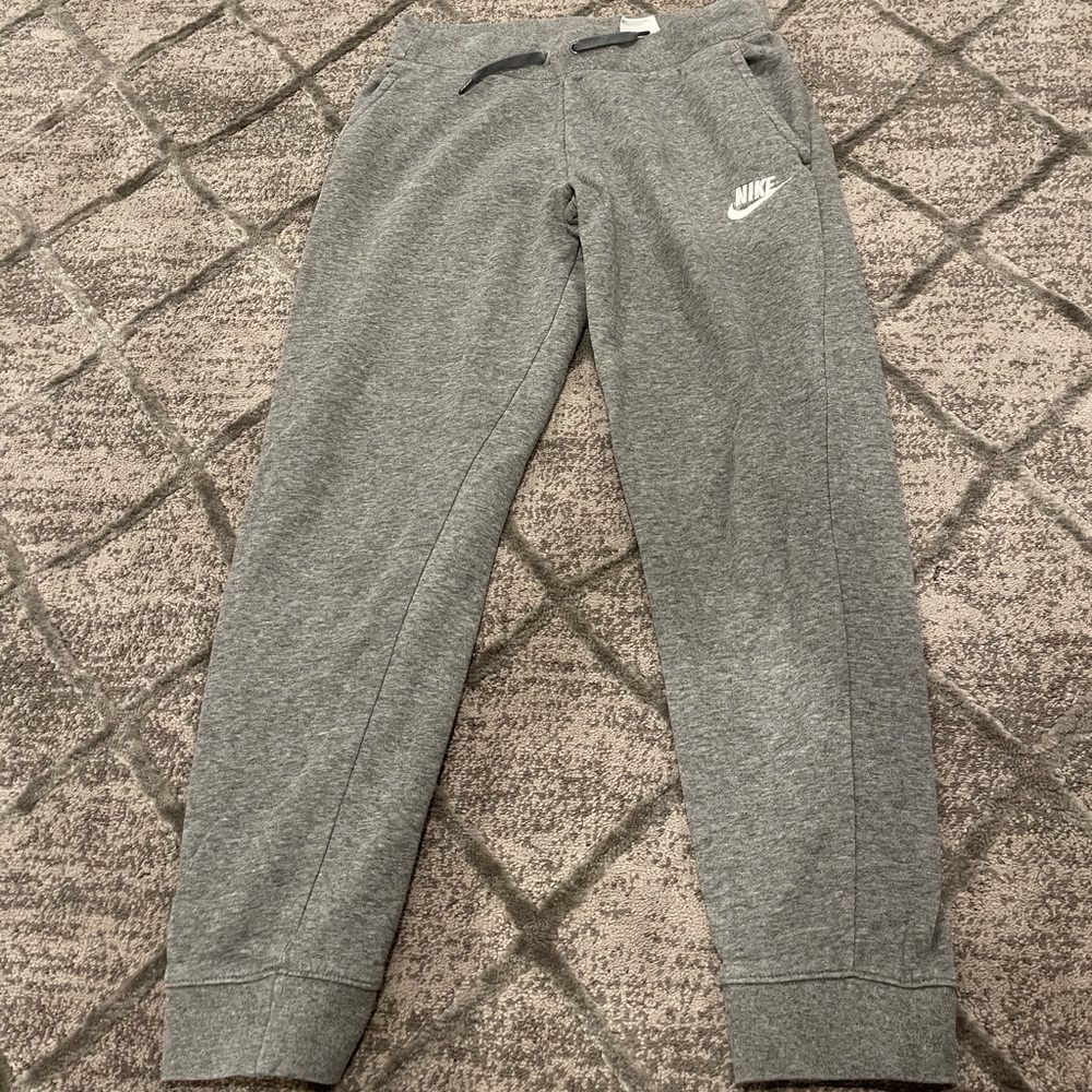 Grey Nike sweats size XL fits a women’s small.